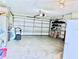 Spacious two-car garage with ample storage, bright lighting, and access to garage door hardware at 6398 17Th N Pl, St Petersburg, FL 33710