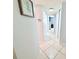 Hallway featuring neutral paint, tile floors, and doors leading to other rooms in the home at 6398 17Th N Pl, St Petersburg, FL 33710
