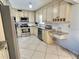 Modern kitchen equipped with stainless steel appliances, granite countertops, and custom cabinetry at 6398 17Th N Pl, St Petersburg, FL 33710