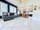 Cozy living room with tiled floors and a view to the dining area, perfect for relaxing and entertaining guests at 6398 17Th N Pl, St Petersburg, FL 33710