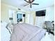 Spacious main bedroom features a king bed, ceiling fan, and large dresser with a TV at 6398 17Th N Pl, St Petersburg, FL 33710