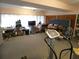 Spacious basement with ceiling fan, window and laminate floors at 7124 Jasmin Dr, New Port Richey, FL 34652