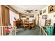 Dining room with wood table, seating for six, neutral paint and decor at 7124 Jasmin Dr, New Port Richey, FL 34652