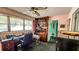Office with desk, bookcase, vintage chair, and exterior window at 7124 Jasmin Dr, New Port Richey, FL 34652