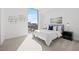 Modern bedroom with a large window offering city views, contemporary art, and stylish furnishings at 777 3Rd N Ave # 805, St Petersburg, FL 33701