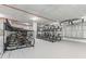 Bicycle storage area has rows of racks, a white floor, a white ceiling, and red pipes at 777 3Rd N Ave # 805, St Petersburg, FL 33701