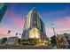 The Reflection Residences is a luxurious high rise building at dusk with a lit-up green top at 777 3Rd N Ave # 805, St Petersburg, FL 33701