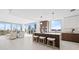 Modern kitchen with a center island, sleek cabinetry, and floor-to-ceiling windows with city views at 777 3Rd N Ave # 805, St Petersburg, FL 33701