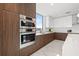 Modern kitchen featuring stainless steel appliances, two-tone cabinets, and bright, natural light at 777 3Rd N Ave # 805, St Petersburg, FL 33701