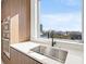 Modern kitchen featuring a stainless steel sink, and stunning city views at 777 3Rd N Ave # 805, St Petersburg, FL 33701