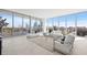 Bright living room with floor-to-ceiling windows offering stunning city views, and contemporary furnishings at 777 3Rd N Ave # 805, St Petersburg, FL 33701