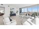 Bright living room featuring modern decor, white sofas, floor-to-ceiling windows, and stunning city views at 777 3Rd N Ave # 805, St Petersburg, FL 33701