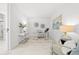 Bright home office with modern decor, a glass-top desk, and stylish furnishings at 777 3Rd N Ave # 805, St Petersburg, FL 33701