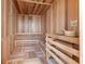 An indoor sauna room offers multi-level wooden benches, floor, and ceiling with a bucket, ladle, and warning sign at 777 3Rd N Ave # 805, St Petersburg, FL 33701