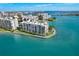 Waterfront condo building with balconies and lush landscaping in a desirable location near the waterway at 7922 Sailboat Key S Blvd # 503, South Pasadena, FL 33707