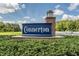 The Connerton community entrance sign with manicured landscaping and blue sky at 8516 Lagerfeld Dr, Land O Lakes, FL 34637