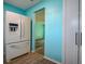 Kitchen area with stainless steel refrigerator and doorway to the living room at 9989 85Th St, Seminole, FL 33777