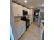 Well-equipped kitchen with modern appliances, bright cabinets, and sleek countertops at 10033 64Th N Ave # 9, St Petersburg, FL 33708
