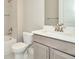 Bright bathroom featuring a shower-tub combo and a stylish vanity with modern fixtures at 10432 Torchwood Sea Way, San Antonio, FL 33576