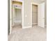 Spacious bedroom with open closet and doorway to another room at 10432 Torchwood Sea Way, San Antonio, FL 33576