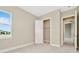 Inviting bedroom featuring plush carpet, a closet, a window and neutral paint scheme at 10432 Torchwood Sea Way, San Antonio, FL 33576