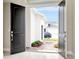Entryway showcasing a pair of arched double doors opening to the exterior of the home at 10432 Torchwood Sea Way, San Antonio, FL 33576