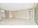 Expansive living area with marble floors, recessed lighting, and multiple entrances at 10432 Torchwood Sea Way, San Antonio, FL 33576