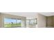 Bright open concept living room with backyard view and breakfast bar at 10432 Torchwood Sea Way, San Antonio, FL 33576