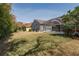 Large backyard with covered patio, screened in pool, and mature landscaping at 10537 Greensprings Dr, Tampa, FL 33626
