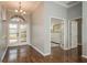 Bright foyer featuring hardwood floors, chandelier, and glass-paneled front door, leading to other rooms in the house at 10537 Greensprings Dr, Tampa, FL 33626
