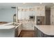 Well-lit kitchen features custom cabinetry, stainless appliances, and sleek countertops at 10537 Greensprings Dr, Tampa, FL 33626
