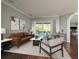 Relaxing living room with a sliding glass door that allows natural light and easy access to a refreshing pool view at 10537 Greensprings Dr, Tampa, FL 33626