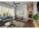 Stylish living room featuring a comfortable sofa, coffee table, area rug, and a large window with natural light at 10537 Greensprings Dr, Tampa, FL 33626
