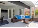 A cozy patio with an outdoor couch and fire pit offers a relaxing outdoor living space at 10537 Greensprings Dr, Tampa, FL 33626