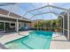 Relaxing pool and spa features screened-in enclosure, patio, and outdoor seating at 10537 Greensprings Dr, Tampa, FL 33626