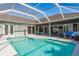 Backyard swimming pool adjacent to the home with an outdoor entertainment area at 10537 Greensprings Dr, Tampa, FL 33626