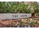 Community entrance sign surrounded by well-maintained landscaping and colorful flowers at 10537 Greensprings Dr, Tampa, FL 33626