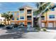 Beautiful two-story condo with a bright exterior, palm trees and convenient parking including handicap parking at 10764 70Th Ave # 5101, Seminole, FL 33772