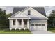 Charming craftsman-style home featuring vertical siding, stylish trim, and a welcoming two-car garage at 108 37Th Ne Ave, St Petersburg, FL 33704