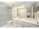 Bathroom with a frameless glass shower and bright vanity and sink at 11200 102Nd Ave # 16, Seminole, FL 33778