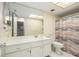 Well-lit bathroom with a spacious vanity and a decorative shower curtain at 11200 102Nd Ave # 16, Seminole, FL 33778