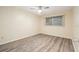 Bright bedroom with a ceiling fan, wood-look floors and a window with blinds at 11200 102Nd Ave # 16, Seminole, FL 33778