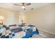 Spacious bedroom with laminate flooring, warm wall color, and ceiling fan at 11200 102Nd Ave # 16, Seminole, FL 33778