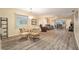 Spacious dining area with hardwood floors, comfortable seating, and natural light at 11200 102Nd Ave # 16, Seminole, FL 33778