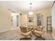 Inviting dining area featuring a glass table and an open connection to the kitchen at 11200 102Nd Ave # 16, Seminole, FL 33778