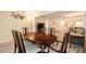The large dining room boasts of hardwood floors and a stunning wooden table with seating for six at 11200 102Nd Ave # 16, Seminole, FL 33778