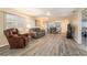 Spacious living room with an open layout, modern flooring, and a dining area at 11200 102Nd Ave # 16, Seminole, FL 33778