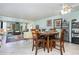 Cozy dining area adjacent to the living room, featuring a round table with seating for four at 127 Tidewater Dr # 127, Bradenton, FL 34210