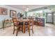 Open-concept dining area with a round table and seamless flow into the adjacent kitchen space at 127 Tidewater Dr # 127, Bradenton, FL 34210