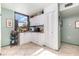 A compact kitchen features white cabinetry, a corner layout, and a window providing natural light at 127 Tidewater Dr # 127, Bradenton, FL 34210